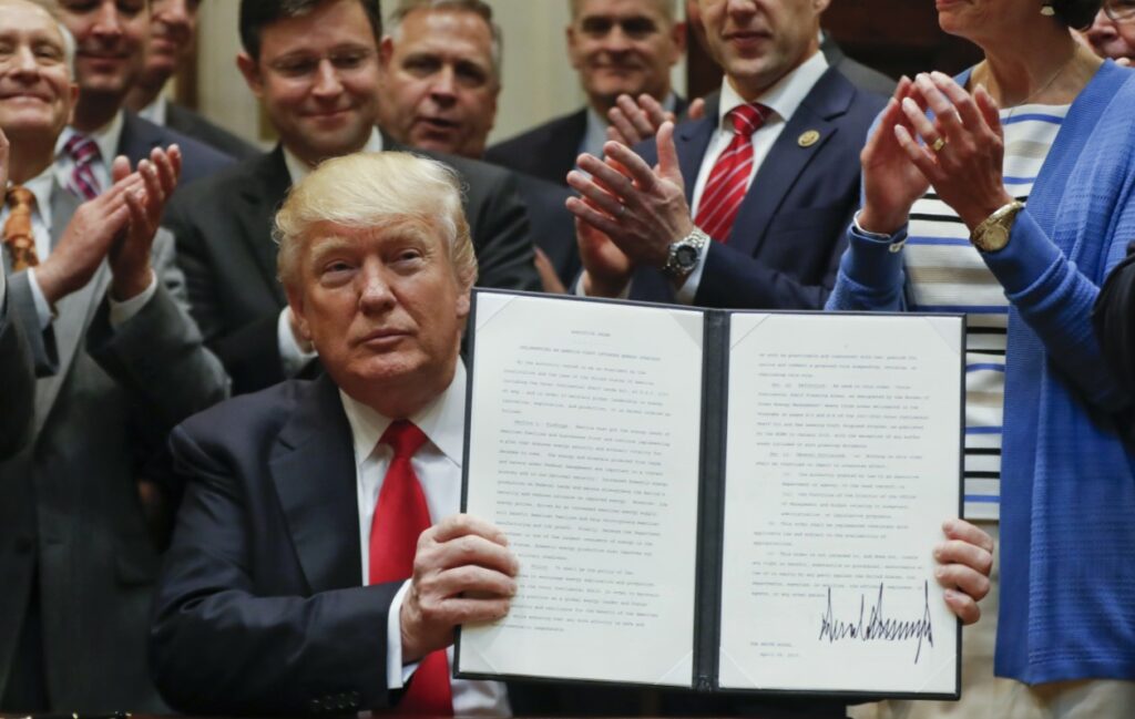 Donald Trump signs executive order in 2017; Source: White House