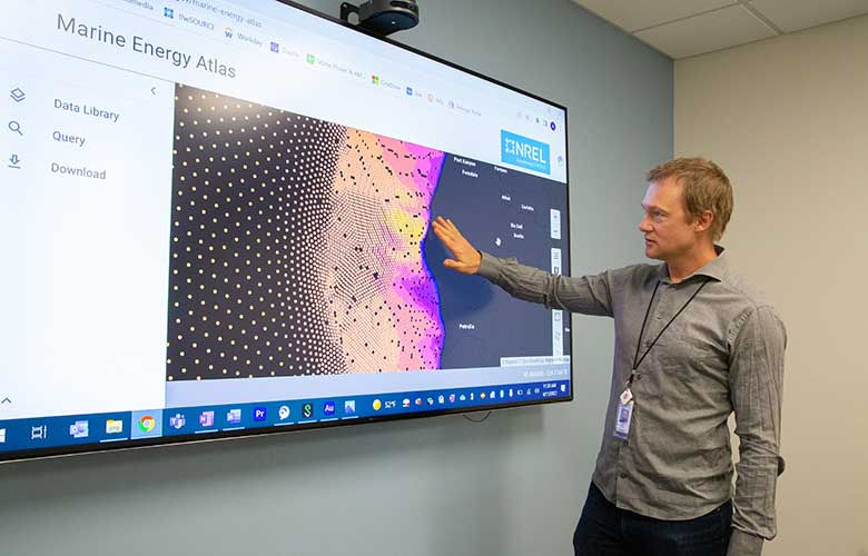 Levi Kilcher, a senior scientist who helped launch the Marine Energy Atlas, demonstrating new Marine Energy Atlas’ features (Courtesy of NREL/Photo by Taylor Mankle)