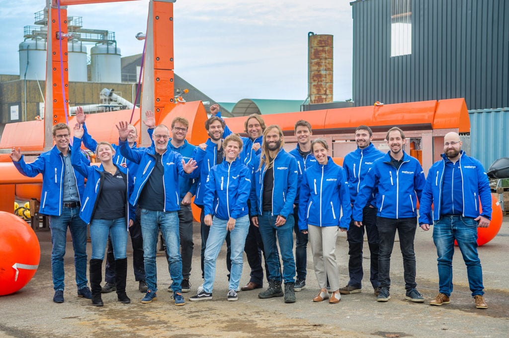 SeaQurrent's team in front of its TidalKite tidal energy device (Courtesy of SeaQurrent)
