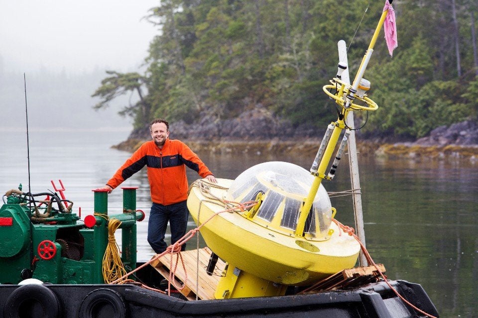 Brad Buckham from PRIMED showcasing a similar type of buoy-based wave data collection platform that will be deployed in the waters off Yuquot (Photo courtesy of UVic Photo)