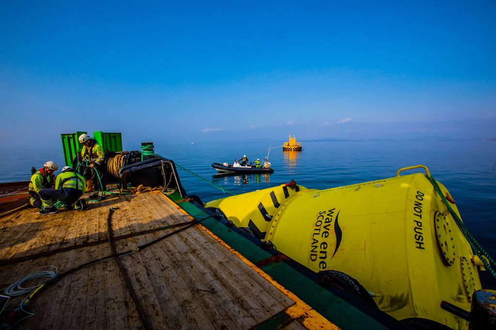 AWS’ Waveswing device and EMEC’s test support buoy offshore Orkney (Courtesy of EMEC/Photo by Colin Keldie)