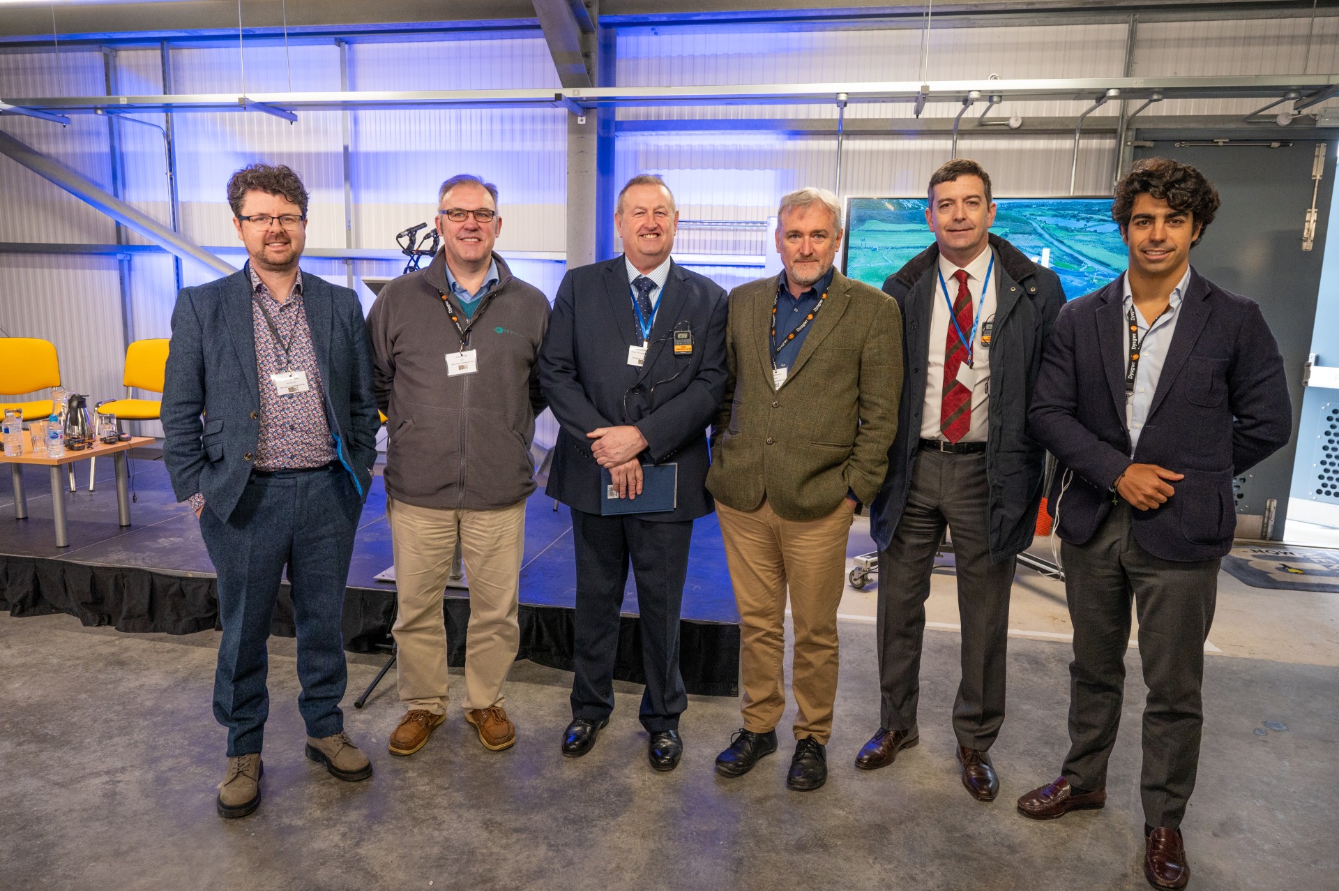 Dafydd Gruffydd, with tidal energy technology developers at Morlais Substation for Catching the Tide event.