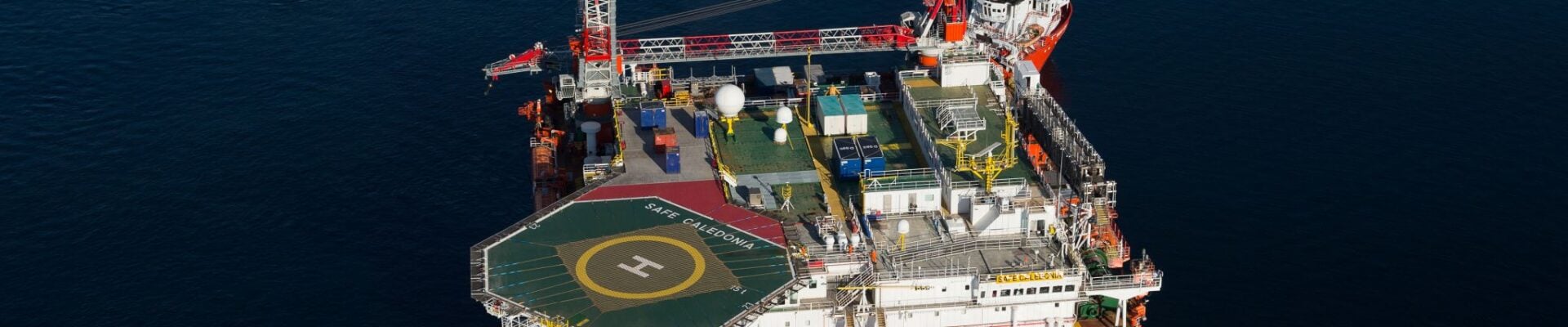 An offshore platform being approached by a small vessel