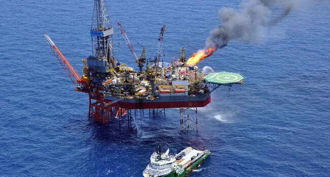 An offshore platform with a vessel next to it