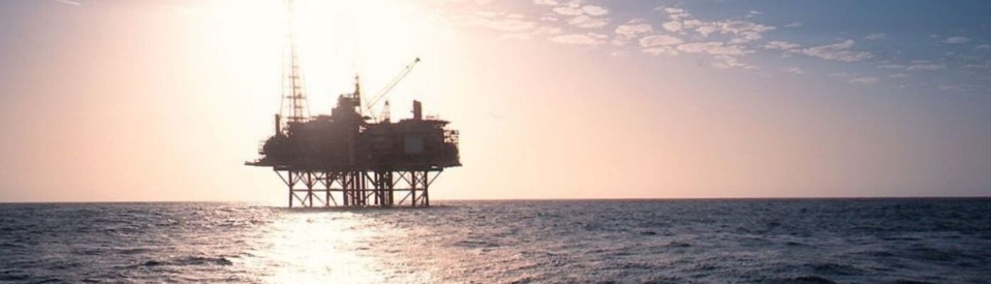 An offshore platform at sunset