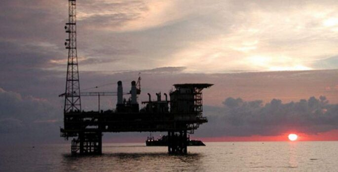 An offshore platform at sunset