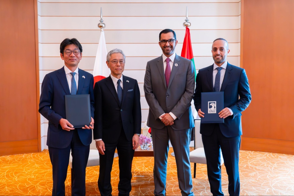Four men standing next to each other
