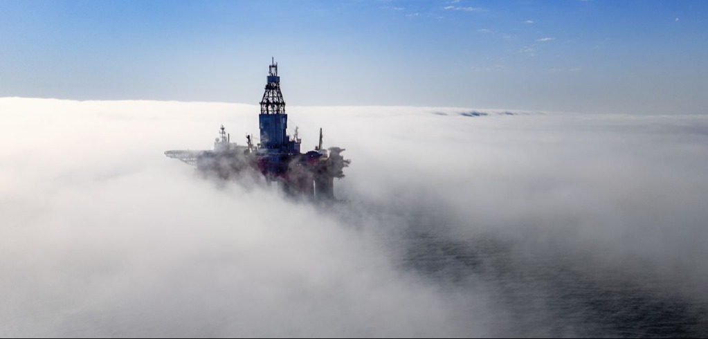 An offshore rig surrounded by fog