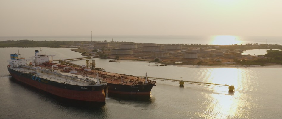 Two large vessels at sunset