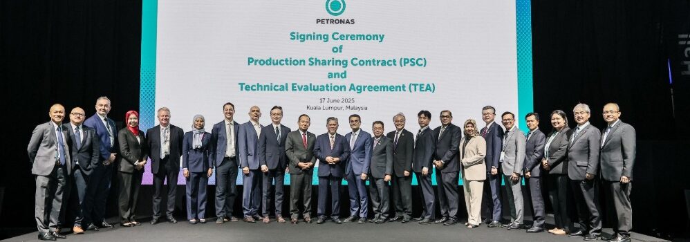 Several people standing in line on stage