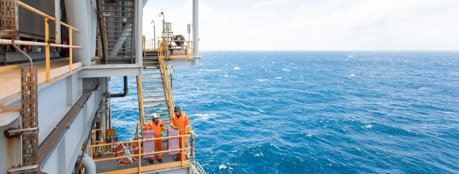 Two workers on an offshore platform