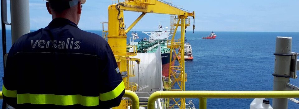 Man seen from behind standing on an offshore platform