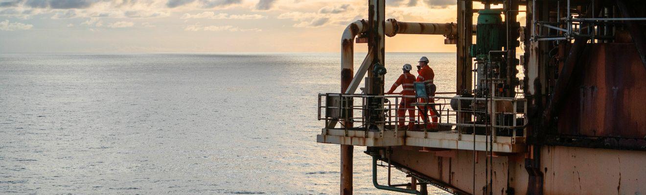 Two workers on an offshore platform