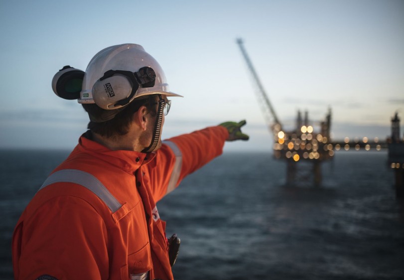 Man pointing at offshore platform