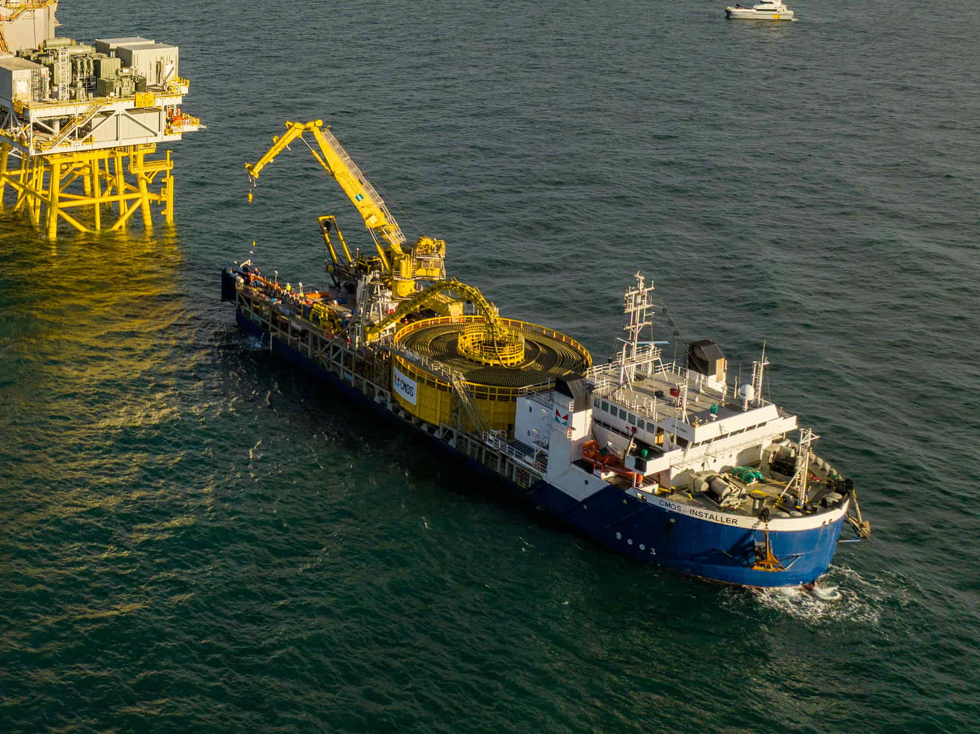 First export cable pull-in: Enshore Subsea’s CMOS Installer at Inch Cape’s offshore substation platform.